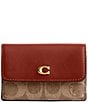 COACH Mini Signature Canvas Trifold Wallet, Color:Tan Rust - Image 1