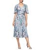 Ignite Evenings Surplice Neck Elbow Flutter Sleeve Ruched Waist Shimer Floral Print A Line Midi Dress - Image 1