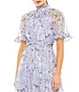 Mac Duggal Ruffle Mock Neck Short Flutter Sleeves Floral Printed Chiffon Flounce Hem A-Line Midi Dress, Color:Lilac Multi - Image 3