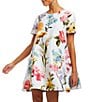 Color:Midnight Ocean - Image 1 - Cecily Reversible Mixed Floral Print Stretch Crepe Bow Tie Back Short Sleeve Crew Neck Mini A-Line Dress