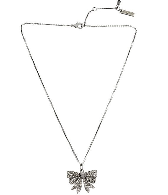 https://dimg.dillards.com/is/image/DillardsZoom/mainProduct/kurt-geiger-london-signature-eagle-bow-crystal-short-pendant-necklace/00000000_zi_37dbf996-8e8f-453a-8369-6fd2dbd9e651.jpg