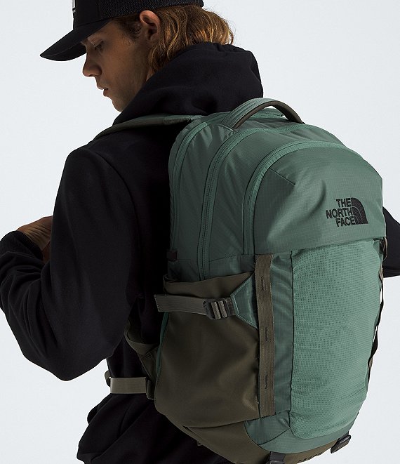military green north face backpack THE Borealis Commuter Laptop Backpack, Forest Olive/TNF Black-NPF, One Size The pack features a flexible yoke built from custom injection The North Face Borealis 28l
