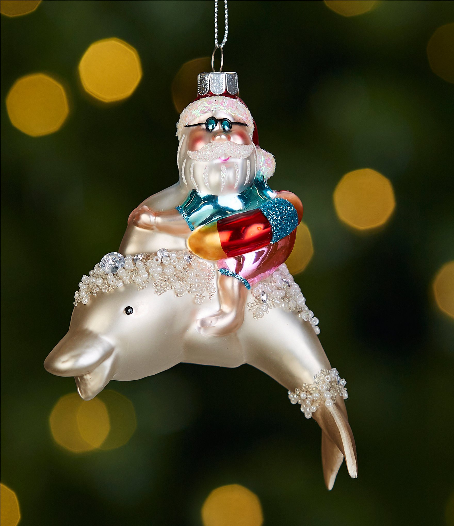 https://dimg.dillards.com/is/image/DillardsZoom/zoom/trimsetter-tis-the-seasun-collection-santa-riding-on-a-dolphin-christmas-ornament/00000000_zi_20391488.jpg